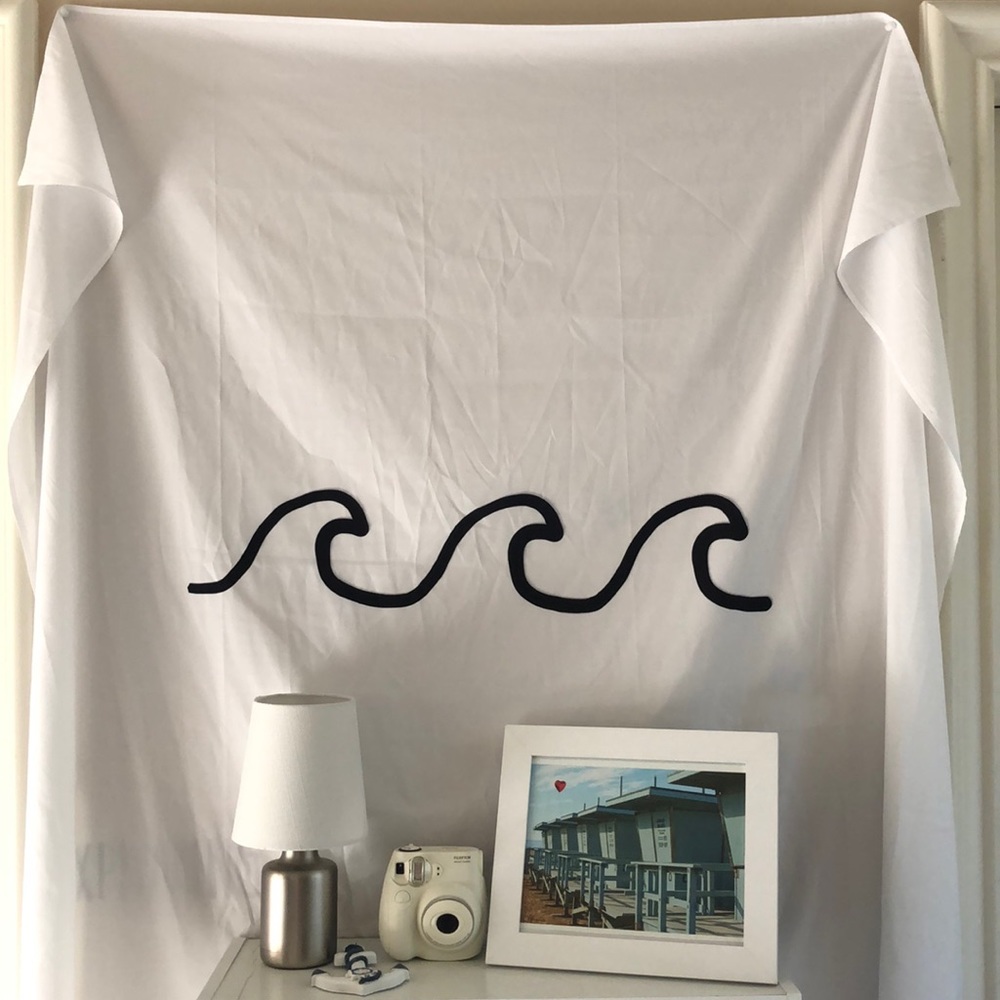 White tapestry with black waves